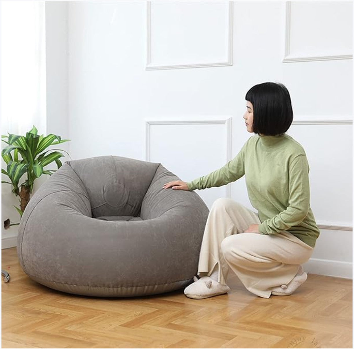 JHATPAT grey plush bean bag chair with a woman sitting next to it, perfect for lounging or gaming.