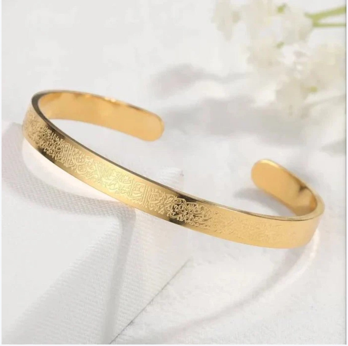 JHATPAT gold-tone bangle bracelet with engraved Islamic Ayat ul Kursi calligraphy. Elegant spiritual jewelry.