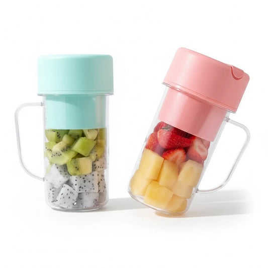 JHATPAT pastel mint and pink portable personal smoothie blenders filled with chopped fruits, featuring handles.